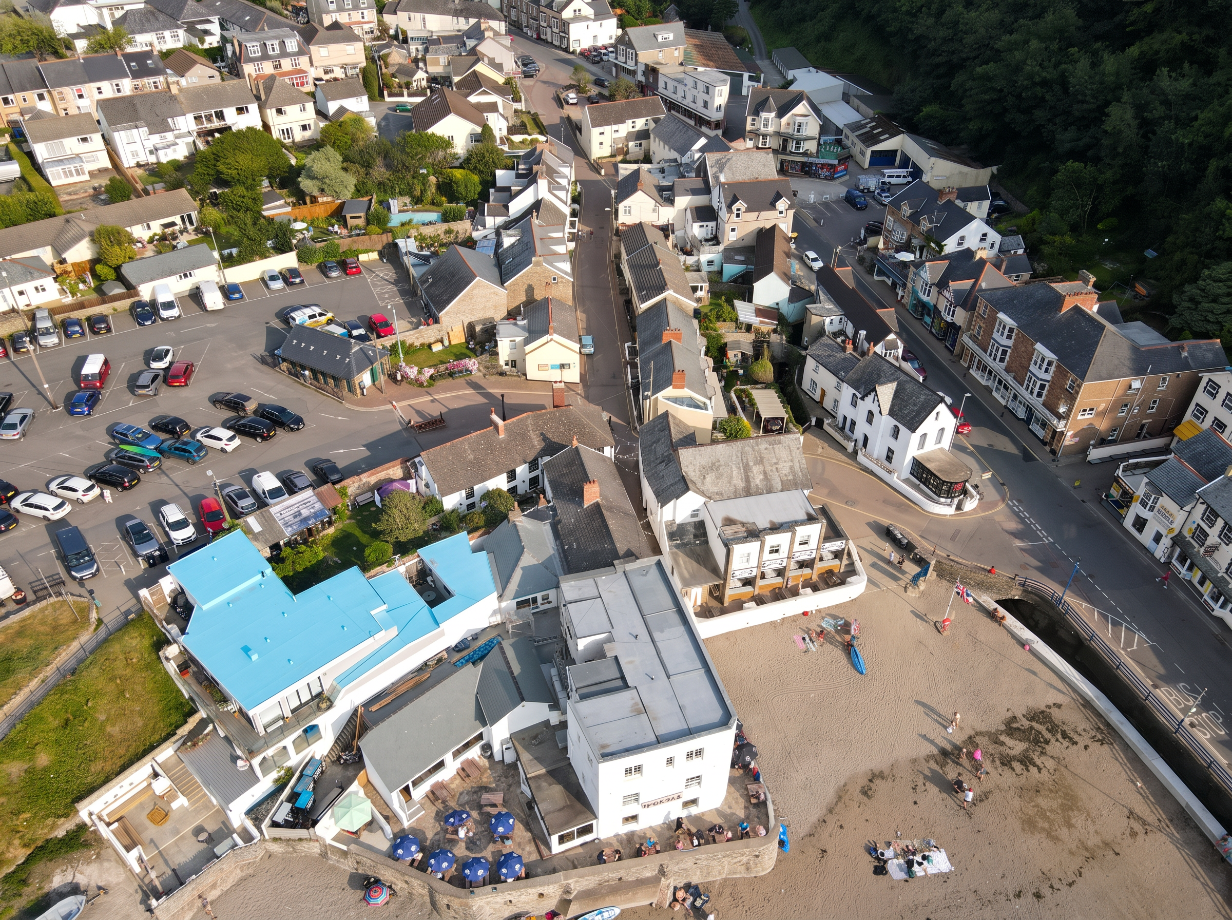 Aerial view showing the rear of Seaside Apartments and adjacent land — development potential