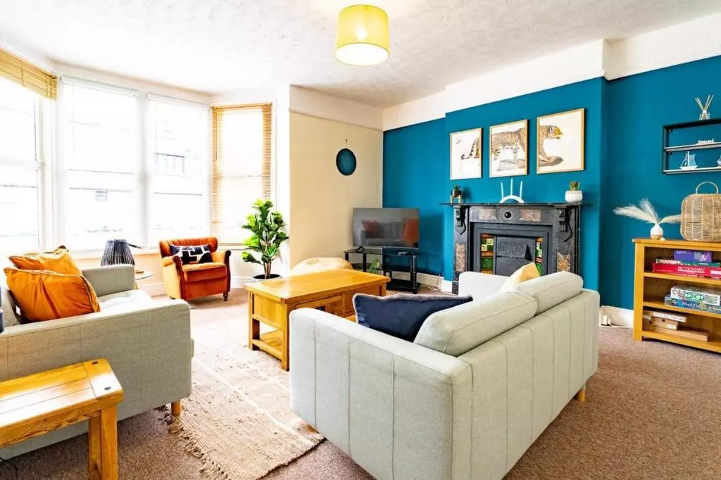 Bright, characterful lounge with fireplace